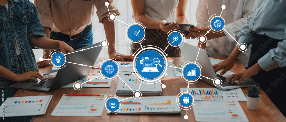 Leinwandbilder Analyst team utilizing BI Fintech to analyze and pointing at financial dashboard paper office. Businesspeople examining report paper on table for business insight. Panorama shot. Scrutinize Amity