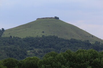 green slopes of a beautiful cliff on a summer day