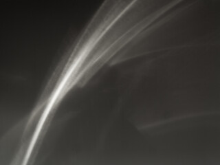 Caustic beam curves. Abstract caustic reflections on black. Can be used as overlay elements for design projects. 