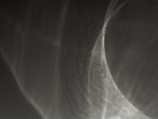 Monochrome caustic texture in light. Abstract caustic reflections on black. Can be used as overlay elements for design projects. 