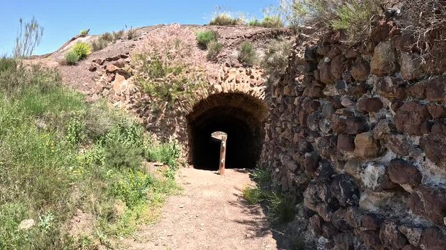SL-A 62 Senda Minera - a path that goes through the tunnel next to the calcination kilns in Lucainena de las Torres, province of Almeria, Andalusia, Spain