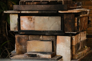 Process of baking rustic bread: Preparing the oven with coal and wood
