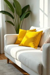 A white couch with yellow pillows in a cozy living room setting