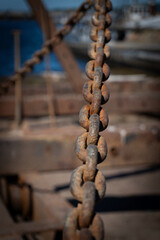 Rusted Chain Hanging in Shipyard