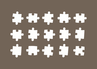 Fifteen White Jigsaw Puzzle Pieces Arranged on a Brown Background
