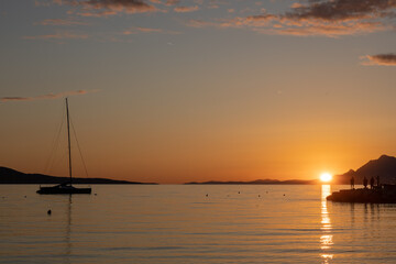 Horizon Sea Sky Background, Sunset sky clouds over sea in the evening with Orange, Yellow sunlight Golden hour in Summer landscape