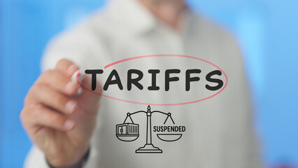 Businessman writing tariffs on a clear screen, with a drawing of a scale comparing a container with...