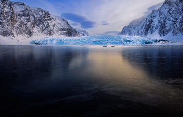 A glacier in Spitsbergen with black ice in the foreground