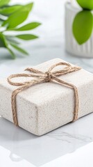 Beige Bar Soap Gift Wrapped with Twine on Marble Surface