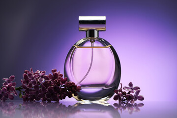 Beautiful lilac flowers and perfume on mirror surface against purple gradient background