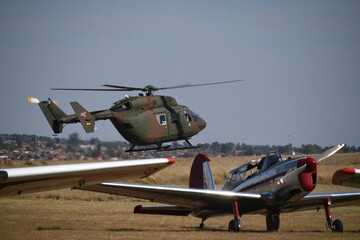 Military Kawasaki BK-117 Helicopter Flying at airshow