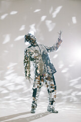 Mirror dancer performing in sparkling suit and hat