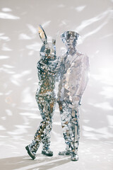 Mirror dancers performing in sparkling costumes