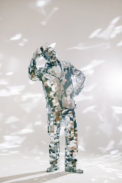 Fototapeta Mirror dancer lifting hat in white studio: elegance and illusion