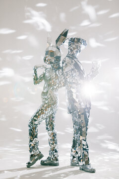 Fototapeta Mirror dancers performing in sparkling costumes