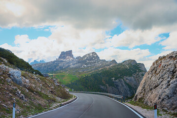 curvy Valparola pass road with view to Averau mountain, south tyrol