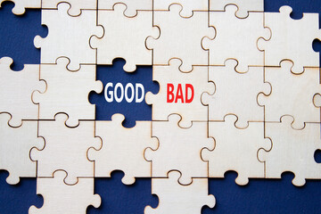 Fototapeta premium Good or Bad symbol. Concept word Good or Bad on wooden puzzle. Beautiful deep blue background. Business and Good or Bad concept. Copy space