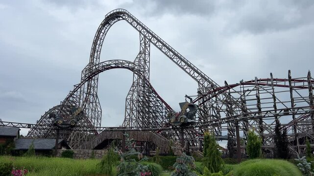 Energylandia, high-speed roller coaster climbs steep track at an amusement park