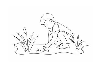 Child playing by the water plants exploring nature