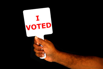 man holding a blank sign board with wrote i voted  