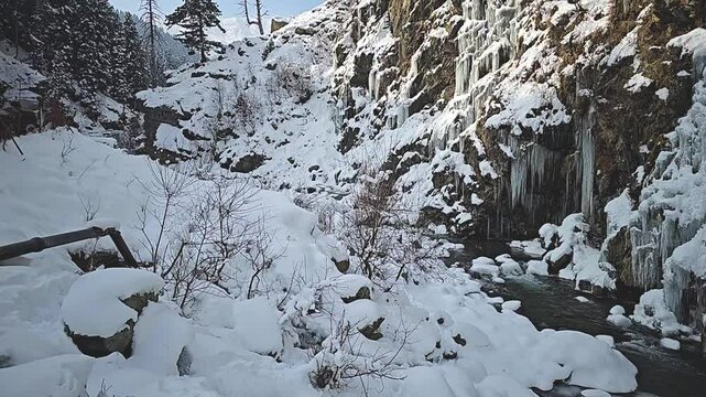 frozen Drung waterfall in Tanmarg Gulmarg Kashmir a popular tourist spot and a marvel of nature showing winter during Chilai Kalan