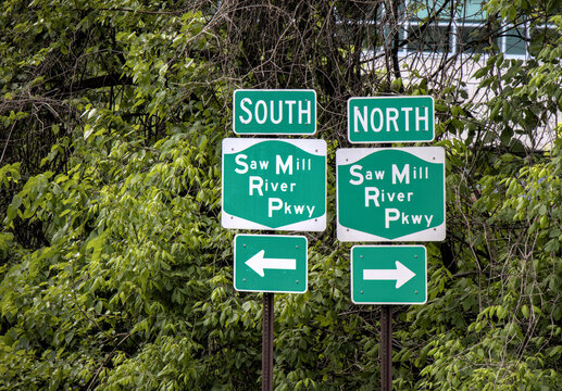 saw mill river parkway south north arrow road sign green direction traffic new york bronx westchester pkwy info signpost