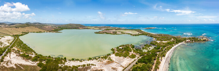 Etang des Salines and Salines Beach panorama in Sainte-Anne, Martinique, France. Salines Beach is a popular tourist destination along Coastal State Forest.
