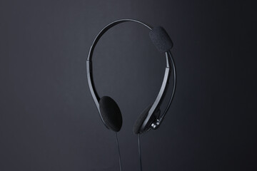 Headset with microphone in air on black background