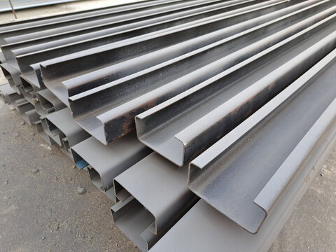 C channel steel or Light-edged channel steel for construction.  C-shaped steel structure.Stacked of Steel Angled Bar