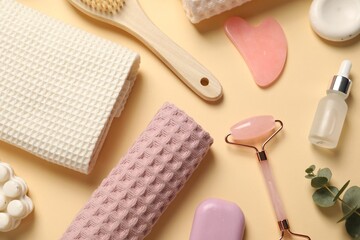 Clean waffle towels, cosmetic products and supplies on beige background, flat lay