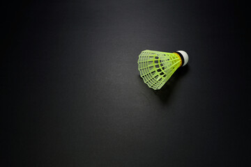 Badminton plastic rocket isolated on dark background close-up view single object sports concept 