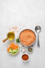 ingredients for Lentil dish with lentils, carrots, leek , and spices. top vertical view, copy space