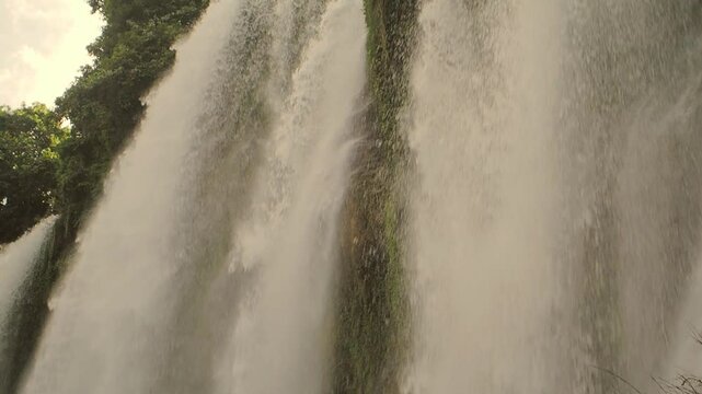 Slow Motion Close-Up of Water Falling at Waterfall