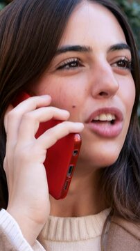 Vertical Video: Empowered Young Woman Talking on Phone in City Street