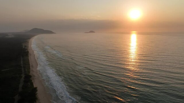 Florianopolis in Santa Catarina during a wonderful sunrise. Mo&ccedil;ambique Beach in aerial view.