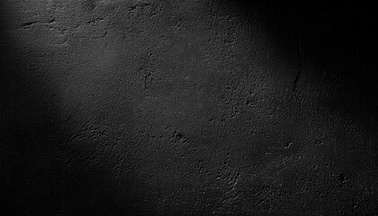 Dark textured surface with light gradient