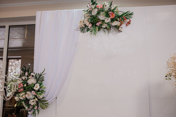 Elegant Wedding Backdrop with Floral Arrangement and Draped White Fabric: Romantic Ceremony Decor,...