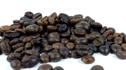 close up of coffee beans on white background