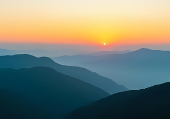 Fototapeta premium A serene mountain landscape at sunrise, with soft golden light illuminating misty peaks and a tranquil forest valley below. Vibrant yet soothing color palette of blues, greens, and warm orange tones. 