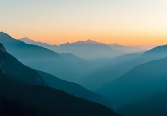Fototapeta premium A serene mountain landscape at sunrise, with soft golden light illuminating misty peaks and a tranquil forest valley below. Vibrant yet soothing color palette of blues, greens, and warm orange tones. 