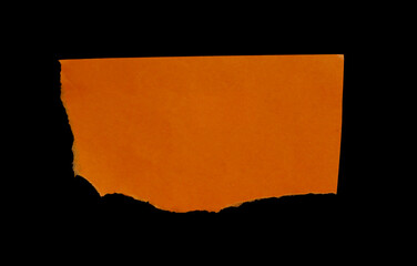 torn ripped paper on black background.