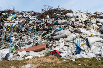 Large piles of plastic and assorted waste dominate the landfill site, cluttering the landscape while drawing attention to the pressing need for sustainable waste management