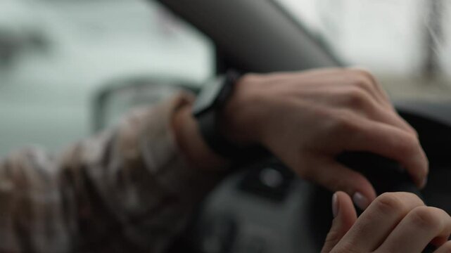 Woman Checking Time in Car