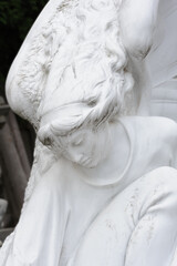 Close to the face of while angel sculpture