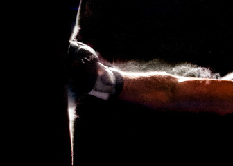 Boxer training with a punching bag.