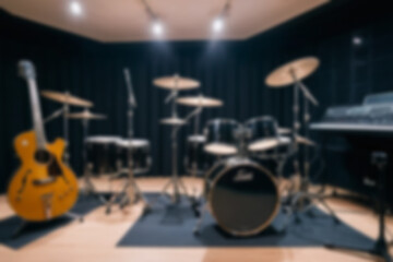 Obraz premium Blurred music studio interior, featuring musical instruments such as guitars and drums neatly lined up, modern classical theme, blurred music studio background.