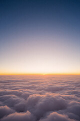 Stunning Aerial View of Sunrise Over a Sea of Clouds