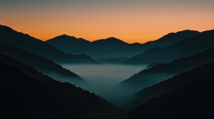 Obraz premium Mountain ranges and valleys are displayed with some atmospheric haze