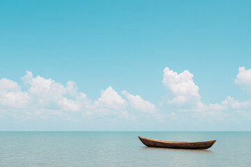 Naklejka premium serene and minimalistic coastal landscape featuring solitary vessel on ultrabright sea with clear background