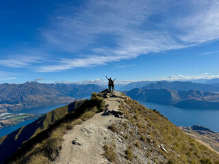 couple on top of a mountain in new zealand